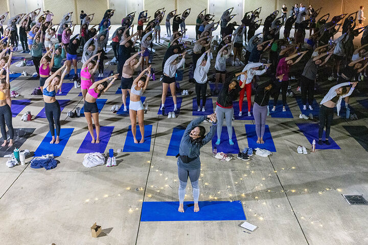 Students participate in a yoga class.